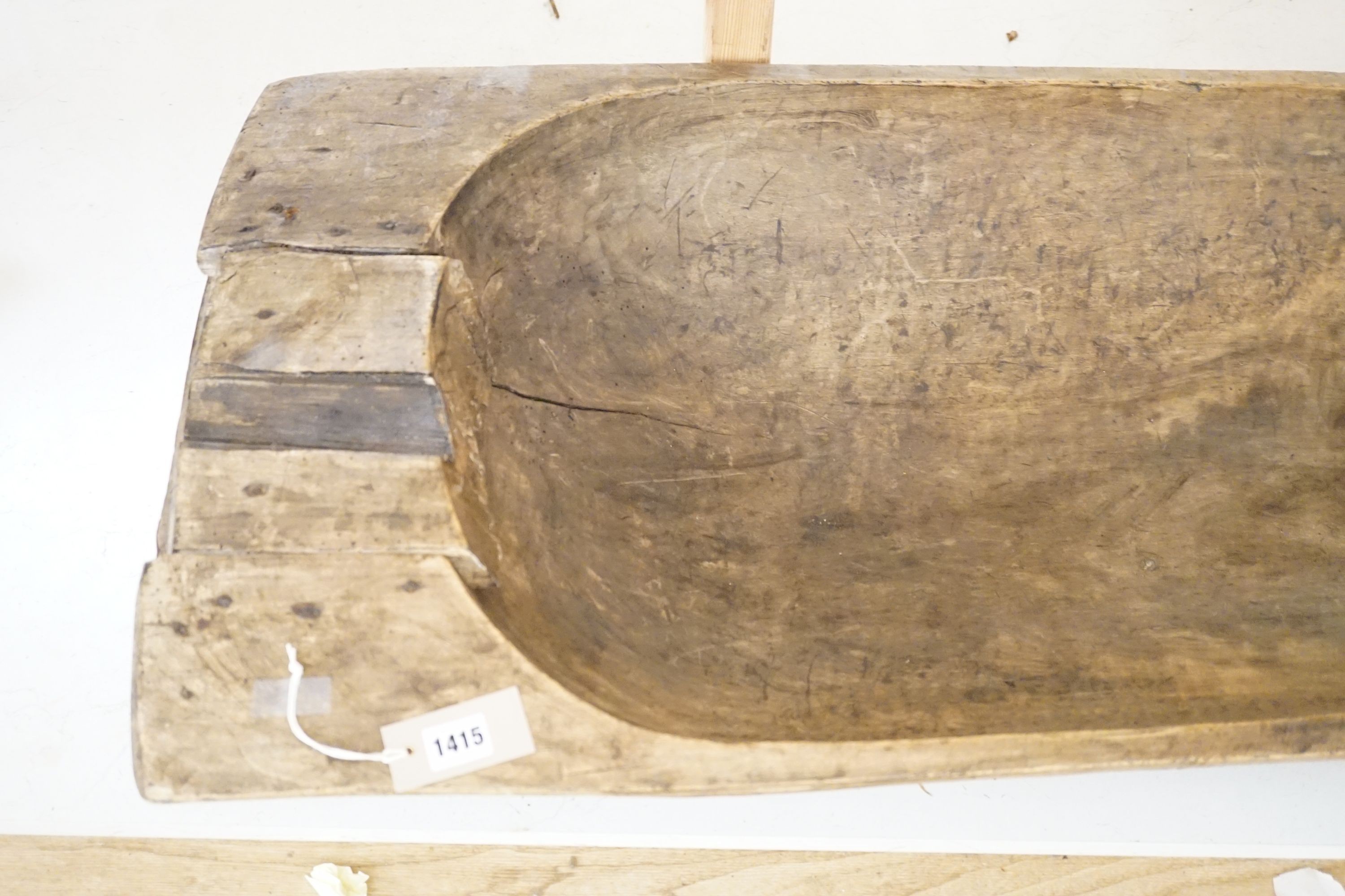 A large 19th century European fruitwood dough trough hewn from a single piece of wood. 132cm x 49cm. *This lot is being sold in aid of the charity Dogs Trust UK with 100% of the hammer price going to the charity